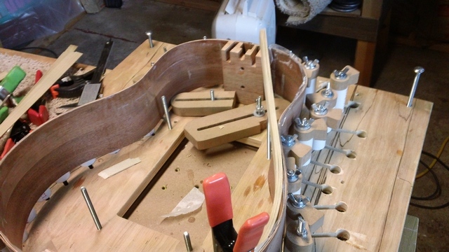 A 5 layer lining being bent into place and clamped. Very easy, as long as the individual strips are not more than .050&quot; thick.