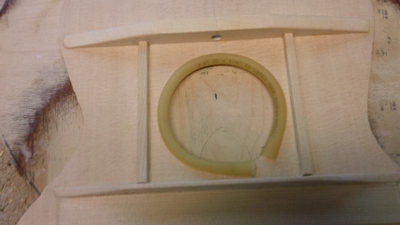 Surgical tubing (Ace hardware) keeps the soundhole from accidental chipping.