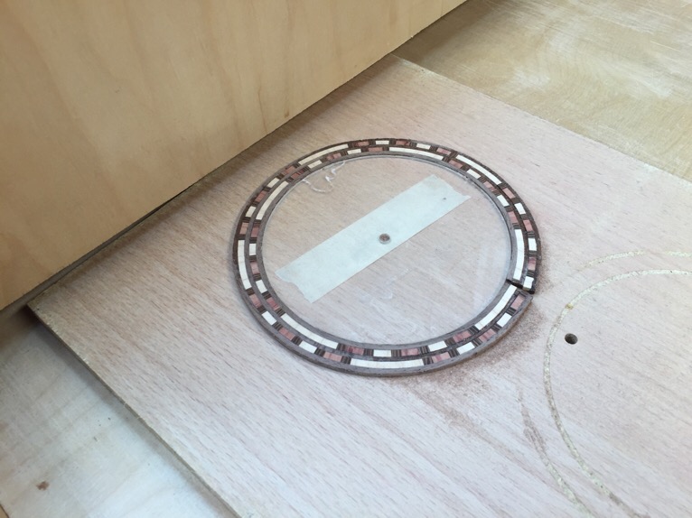 Level sanded in my drum sander carefully. I stuck the center disc to a work board with double stick tape and it stayed put.