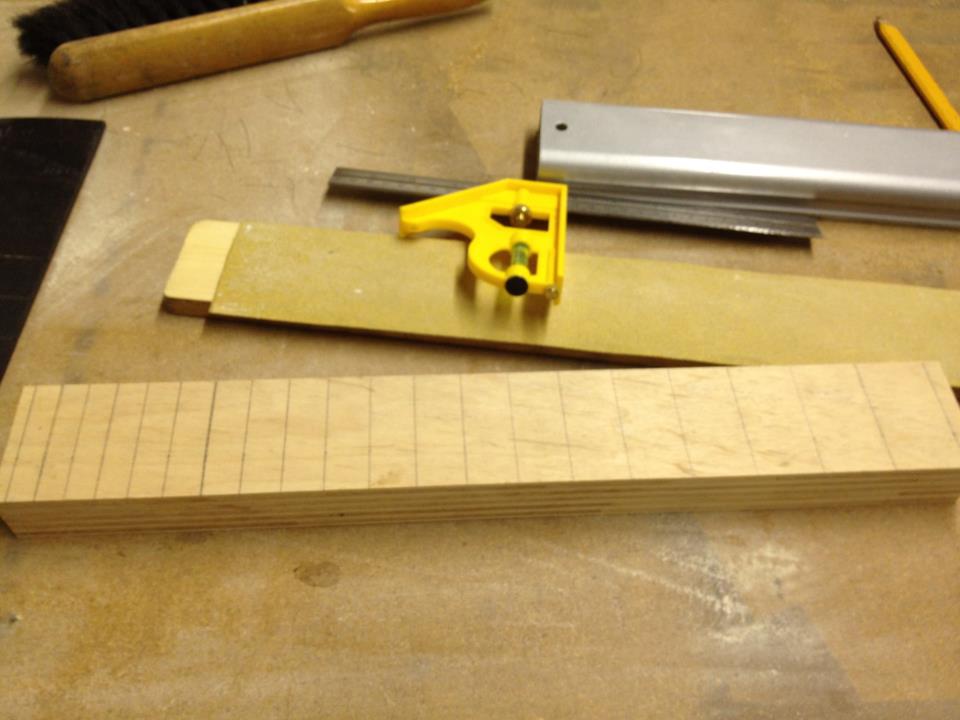 Here I'm laying out the fretting pattern onto the caul. I'll then use the table saw to cut slots where the frets are located on the fingerboard.