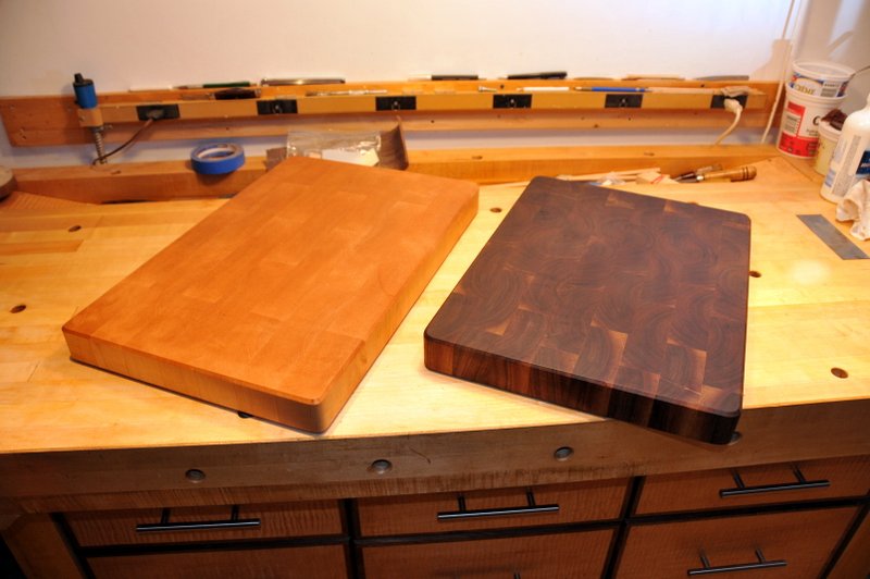 There's the maple board and walnut board side by side.  They've had a mineral oil-beeswax combination rubbed in and they are soooo smooth.