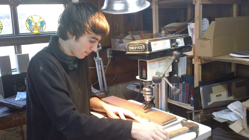 A little love tap to the fret ends to seat them and stabilize them for the pressing-in.